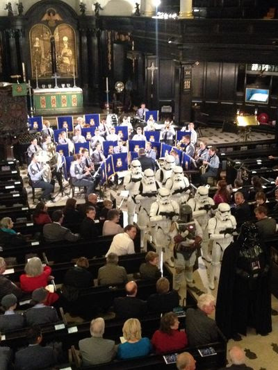 Stormtroopers inside st clements dane church which was lit with stage lights